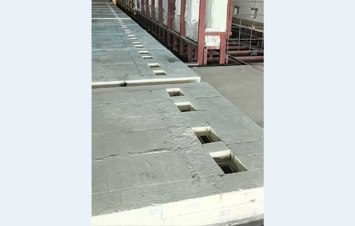 Kiln car base prepared with refractory bricks and reserved openings for post installation