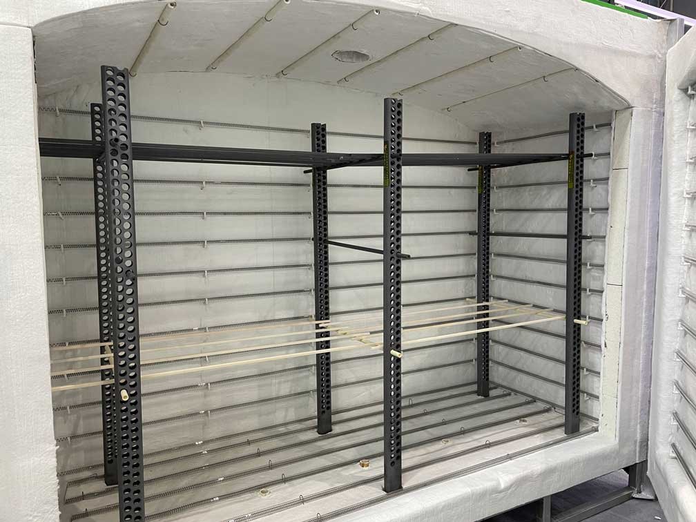 New kiln setup showing the kiln chamber with an installed support frame and beam