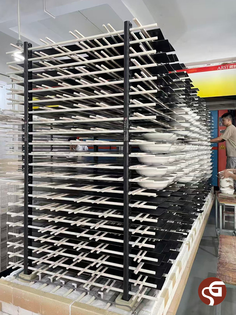 Kiln car loaded on shouguan RBSiC kiln shelves and bone china for factory firing.